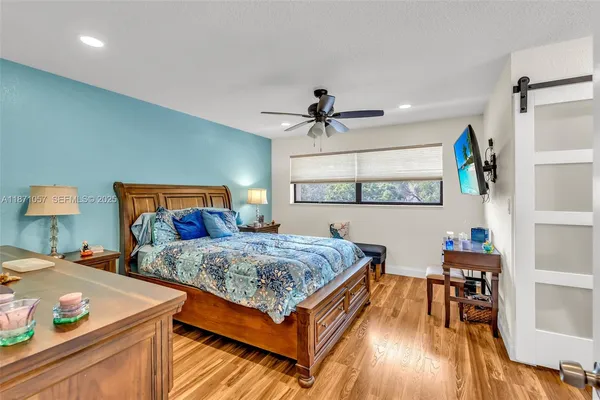 a bedroom with bed and a table