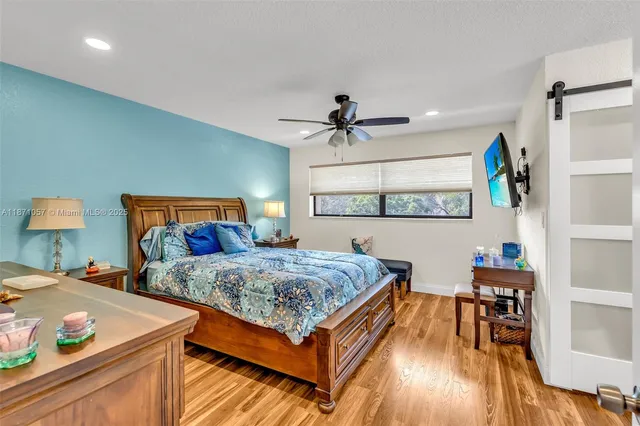 a bedroom with bed and a table