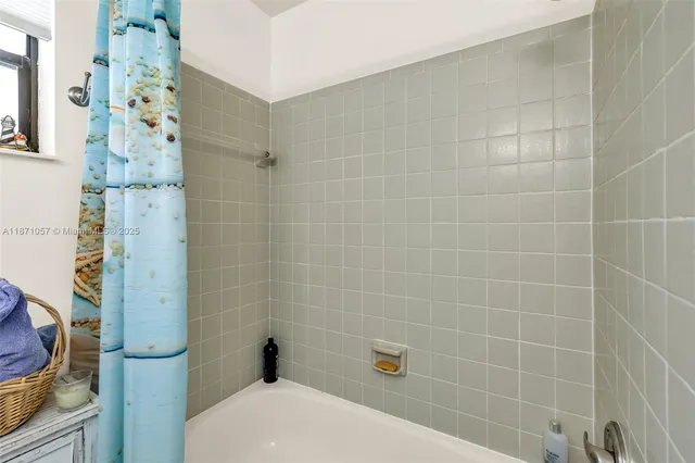 a bathroom with a shower and toilet