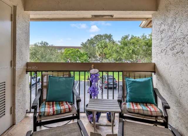 a balcony with furniture and outdoor view