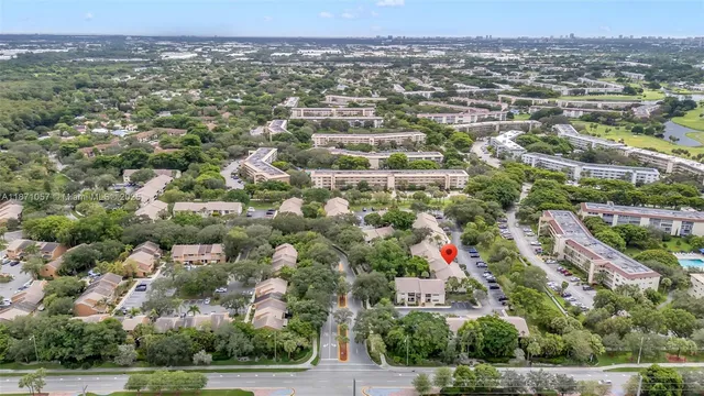an aerial view of residential houses with city view
