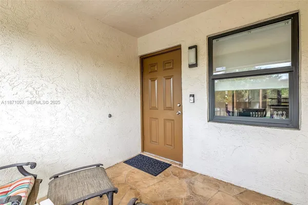 a view of room with furniture and wooden floor