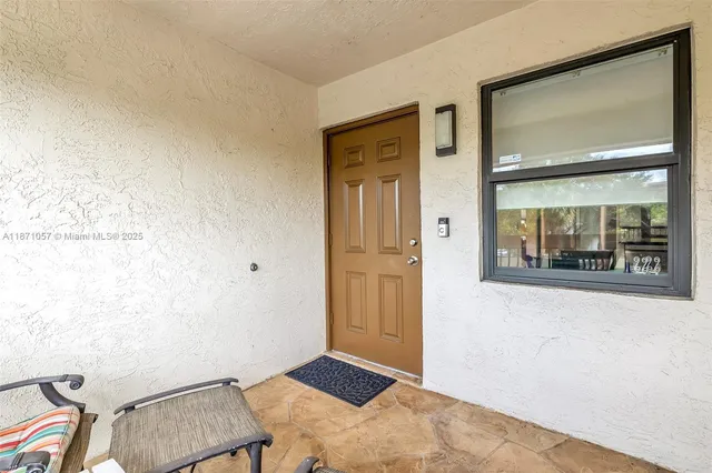a view of room with furniture and wooden floor