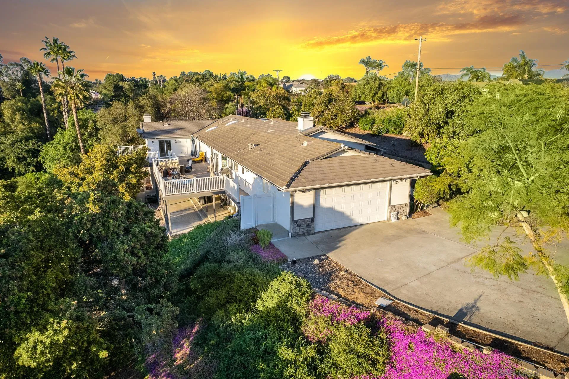 a view of a garden with an outdoor seating