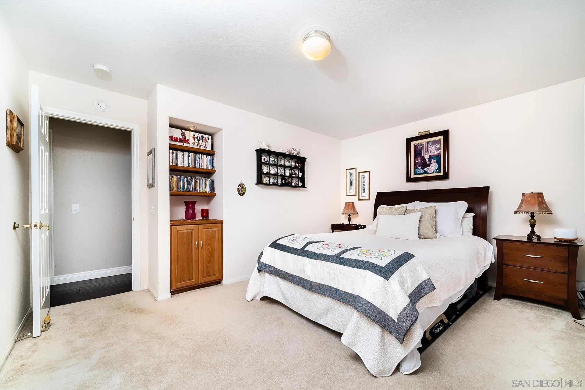 3909 Palomar Drive Fallbrook, CA 92028 - Photo 19 of 43 a spacious bedroom with a bed and a cabinets
