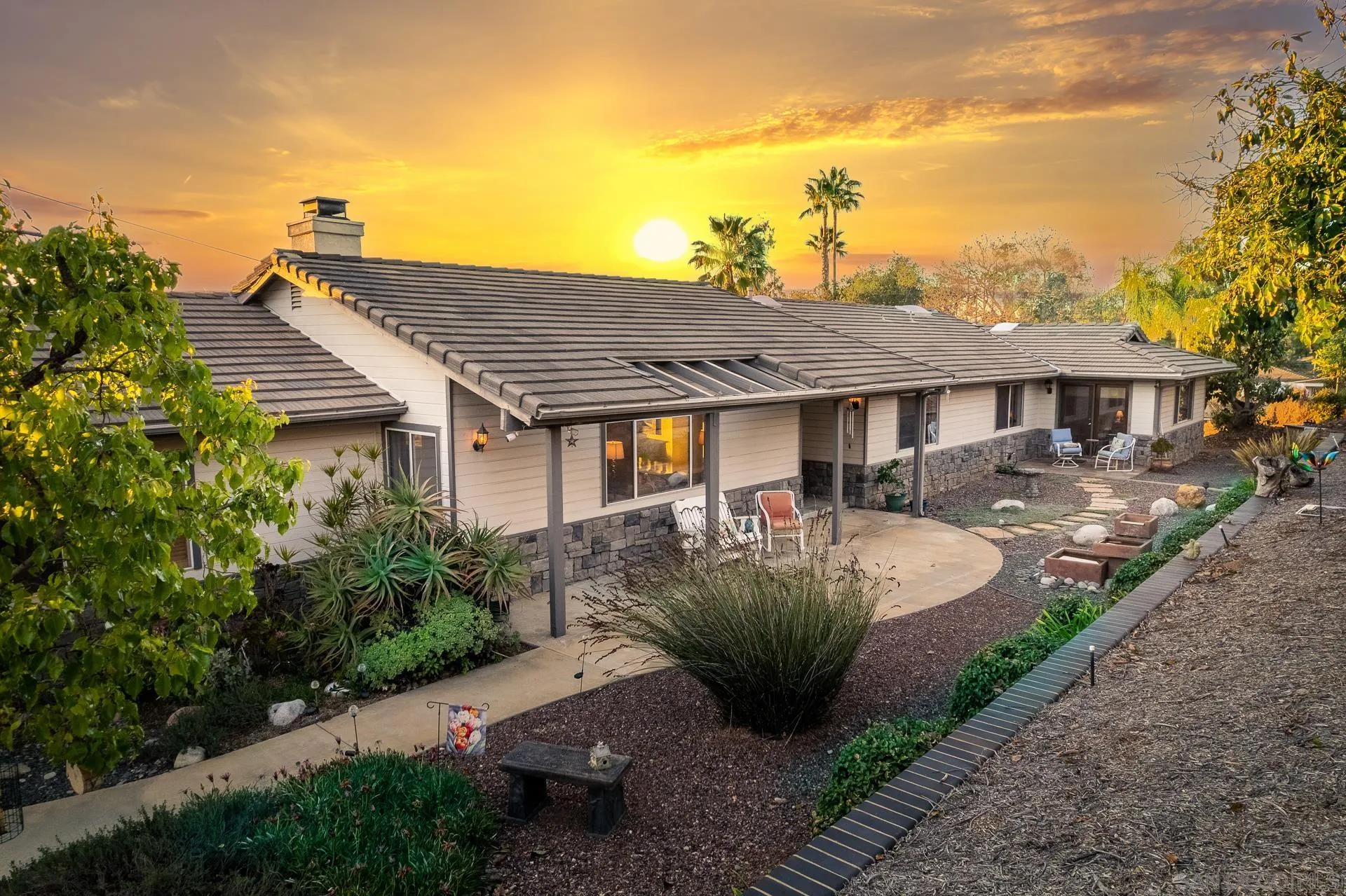 3909 Palomar Drive Fallbrook, CA 92028 - Photo 3 of 43 a front view of a house with garden
