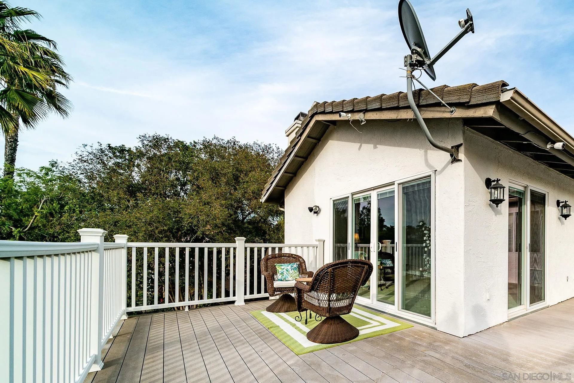 3909 Palomar Drive Fallbrook, CA 92028 - Photo 31 of 43 a view of roof deck with table and chairs and wooden floor
