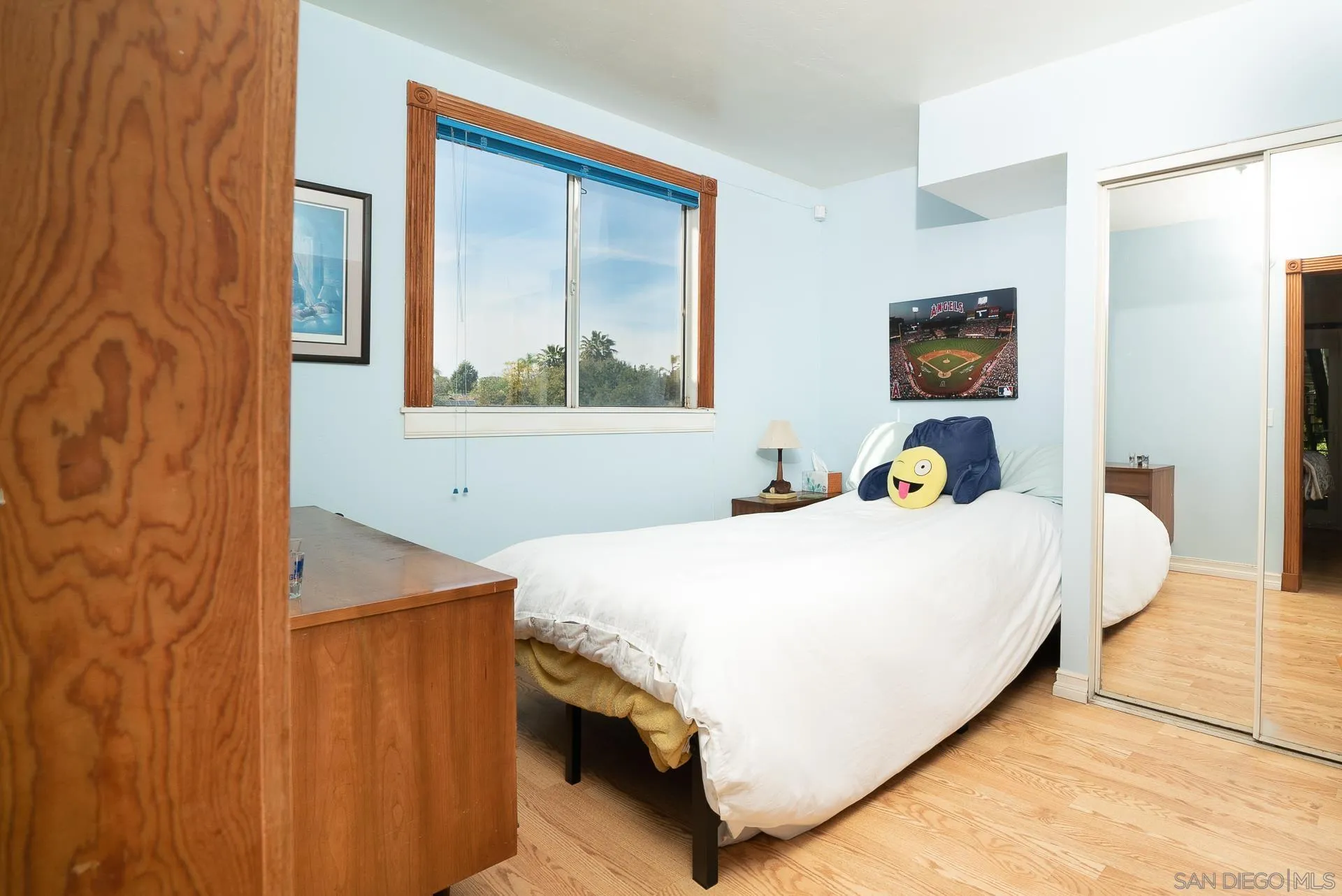 3909 Palomar Drive Fallbrook, CA 92028 - Photo 35 of 43 a bedroom with a bed and wall painting