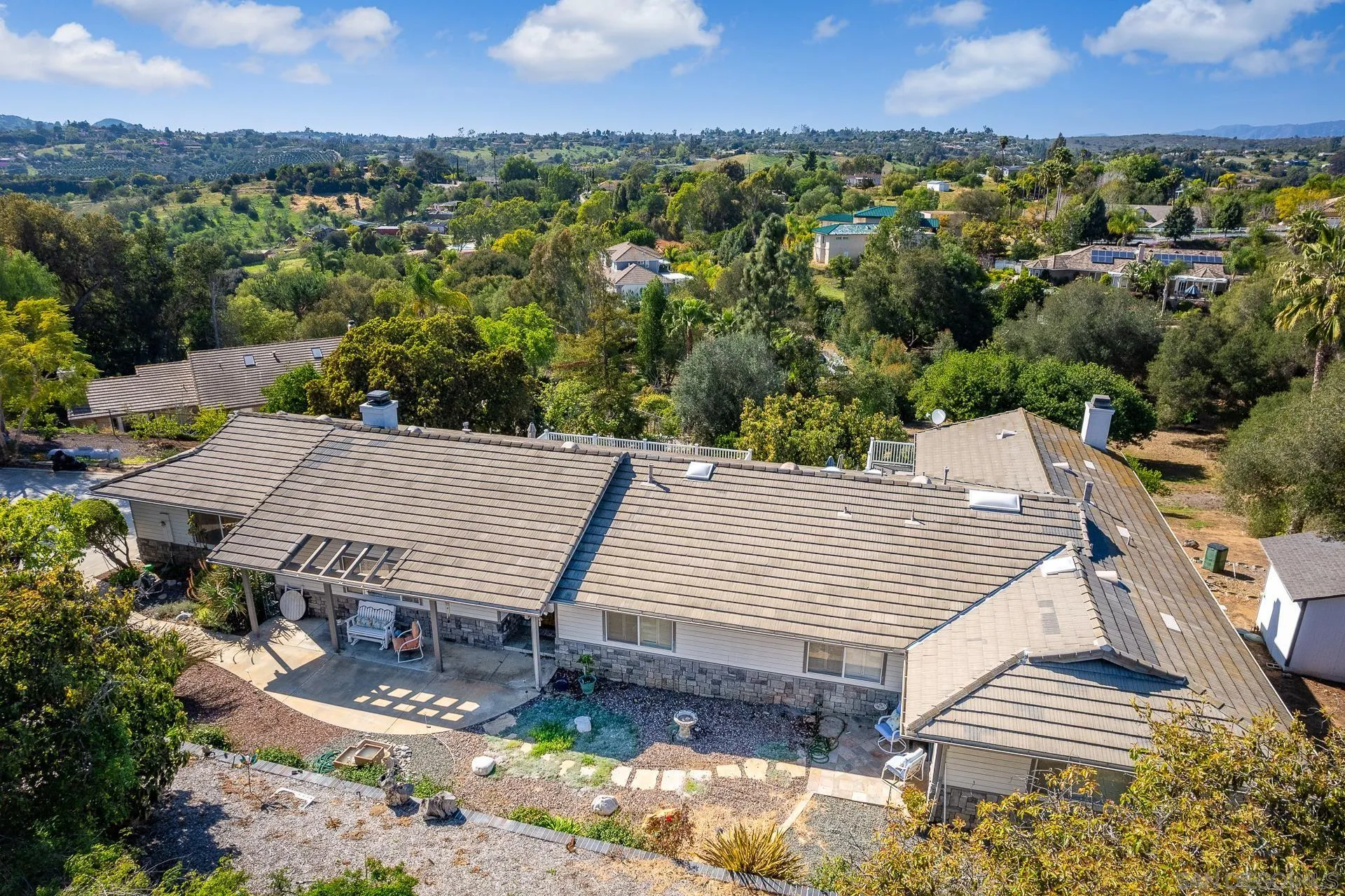 3909 Palomar Drive Fallbrook, CA 92028 - Photo 40 of 43 an aerial view of a house with a yard and mountain view in back