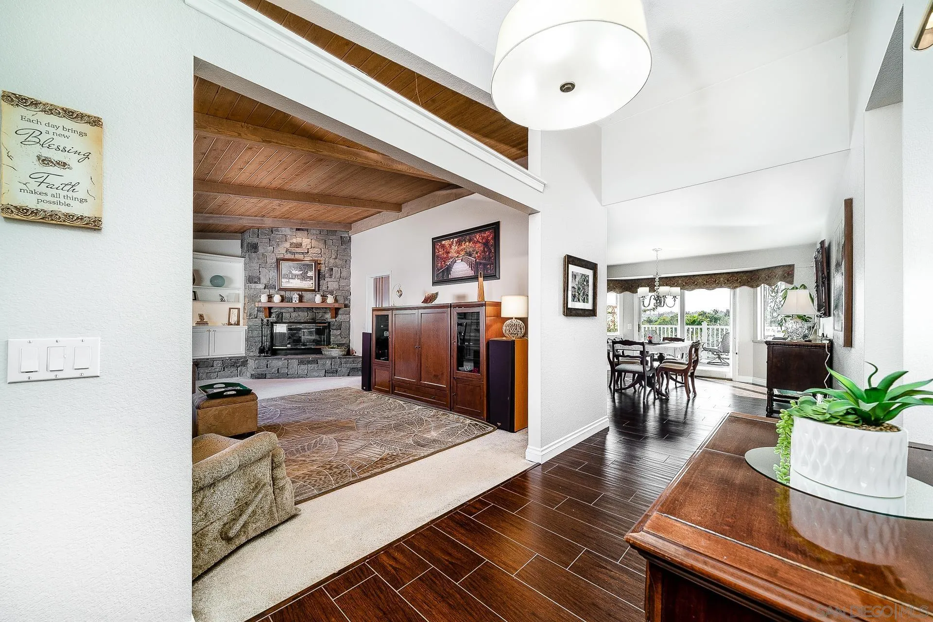 3909 Palomar Drive Fallbrook, CA 92028 - Photo 6 of 43 a living room with furniture and a chandelier