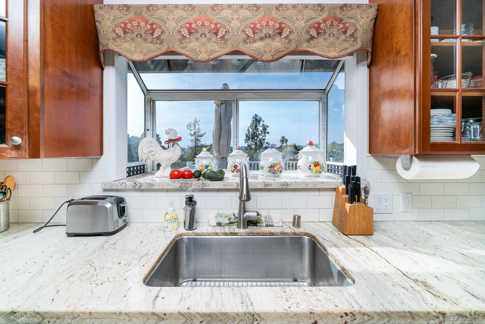 3909 Palomar Drive Fallbrook, CA 92028 - Photo 10 of 43 a kitchen sink with granite countertop a sink and a stove