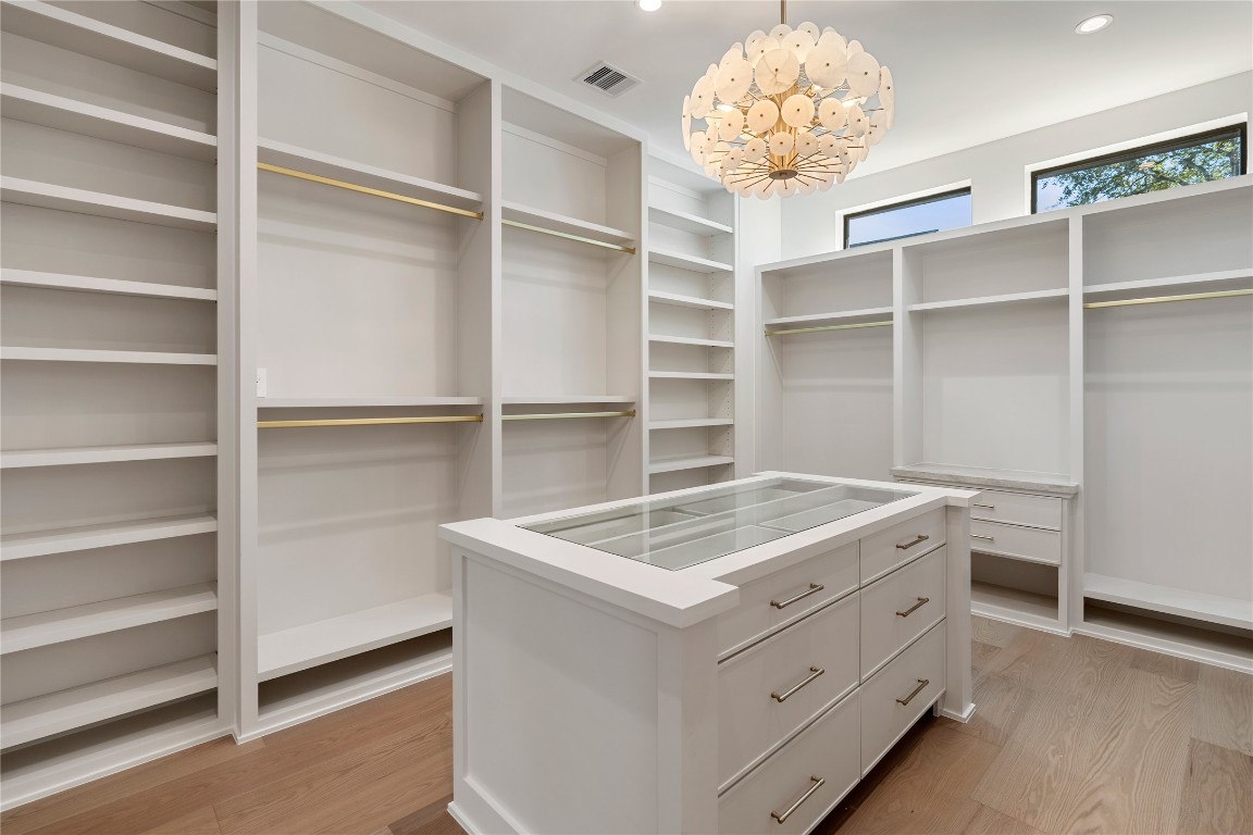 3802 Westerman Street Houston, TX 77005 - Photo 11 of 18 a room with a chandelier and a cabinet