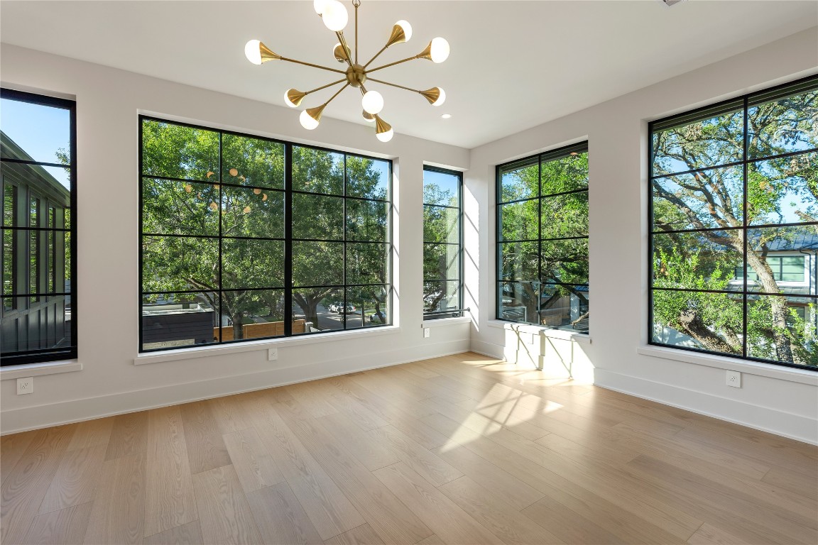 3802 Westerman Street Houston, TX 77005 - Photo 7 of 18 a view of an empty room with wooden floor and a window