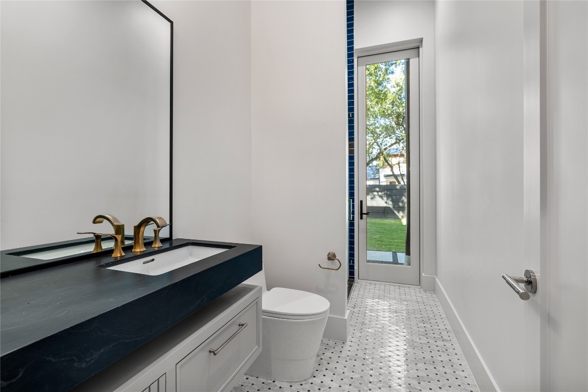 3802 Westerman Street Houston, TX 77005 - Photo 8 of 18 a bathroom with a sink a toilet and a shower