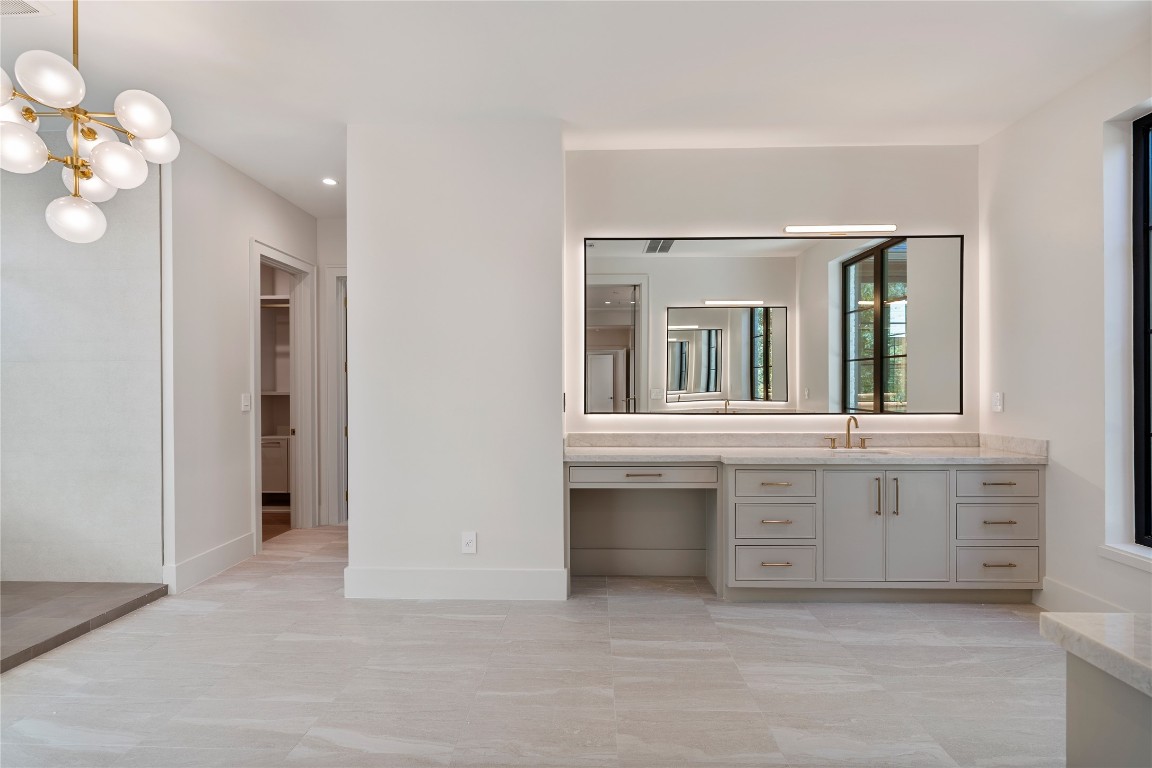 3802 Westerman Street Houston, TX 77005 - Photo 10 of 18 a bathroom with a sink vanity and a large mirror