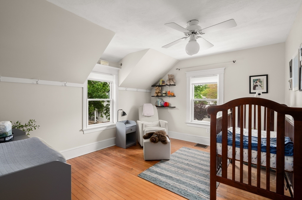 7 Charles Street Danvers, MA 01923 - Photo 19 of 37 a bedroom with furniture window and wooden floor