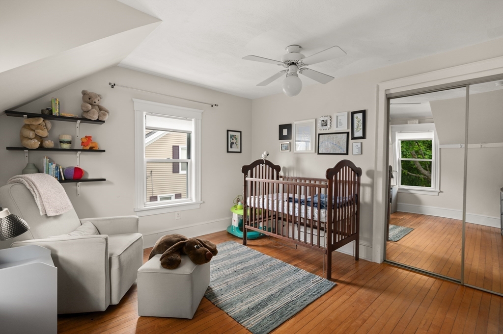 7 Charles Street Danvers, MA 01923 - Photo 20 of 37 a bedroom with furniture and a window