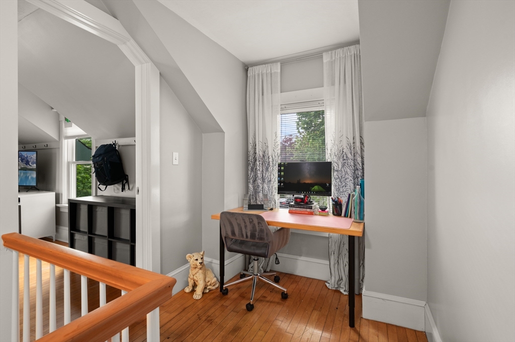 7 Charles Street Danvers, MA 01923 - Photo 22 of 37 a view of a workspace with furniture and a window