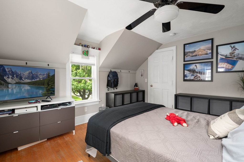 7 Charles Street Danvers, MA 01923 - Photo 24 of 37 a bedroom with a bed and a large window