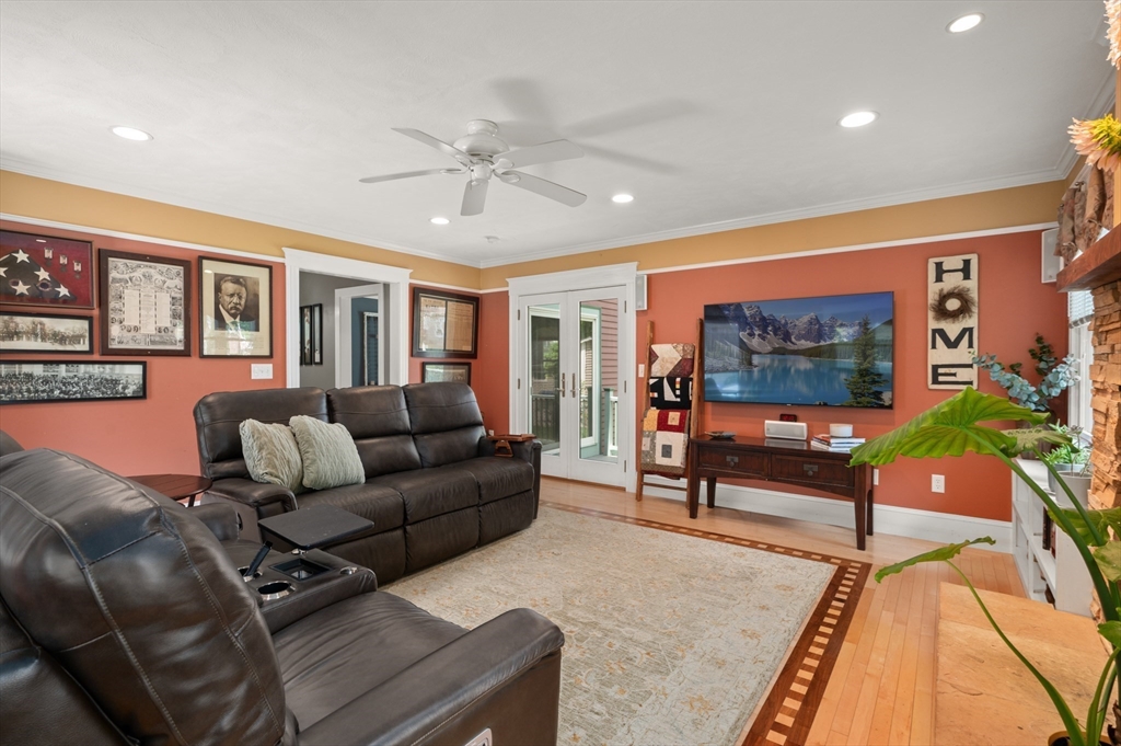 7 Charles Street Danvers, MA 01923 - Photo 3 of 37 a living room with furniture and a flat screen tv