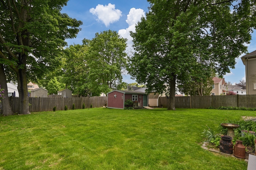 7 Charles Street Danvers, MA 01923 - Photo 32 of 37 a view of a garden with a house in the background