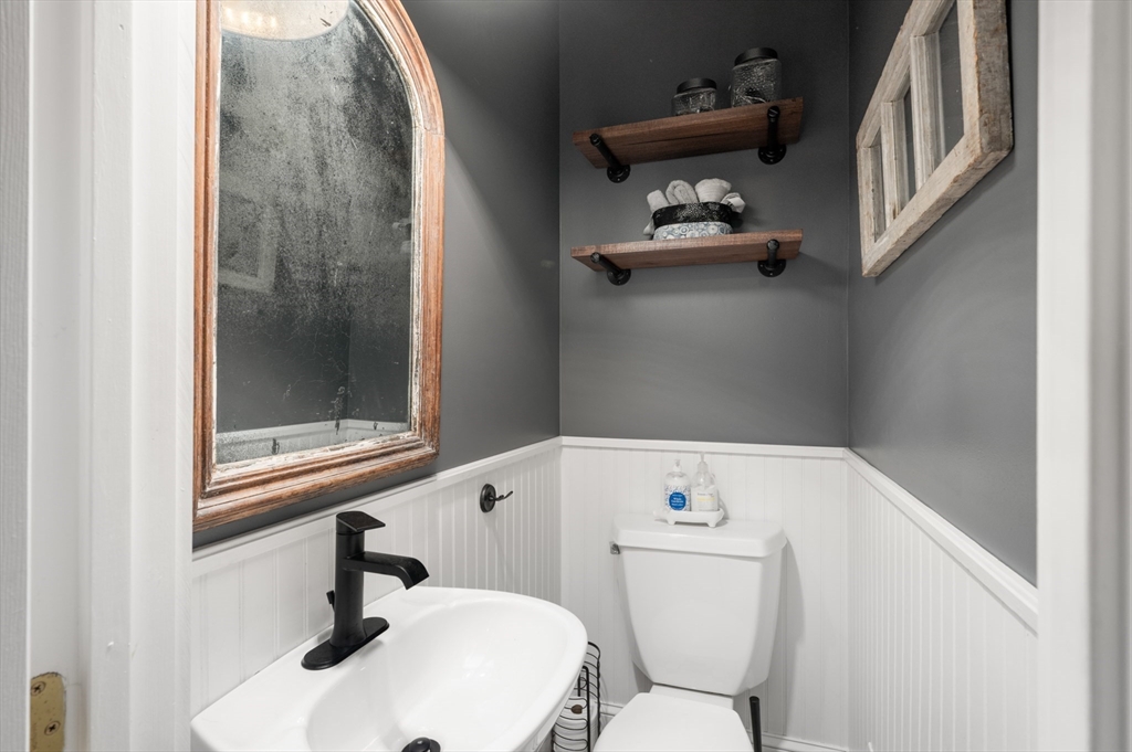 7 Charles Street Danvers, MA 01923 - Photo 7 of 37 a bathroom with a sink and a toilet