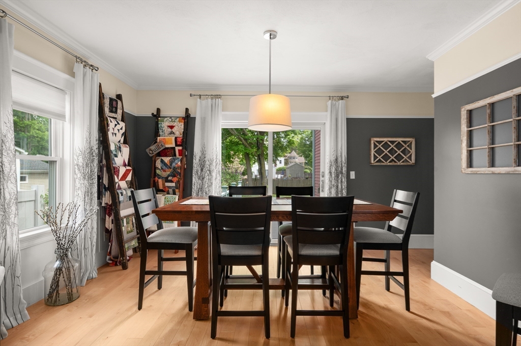 7 Charles Street Danvers, MA 01923 - Photo 8 of 37 a dining room with furniture a chandelier and wooden floor
