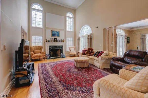 a living room with furniture windows and a fireplace