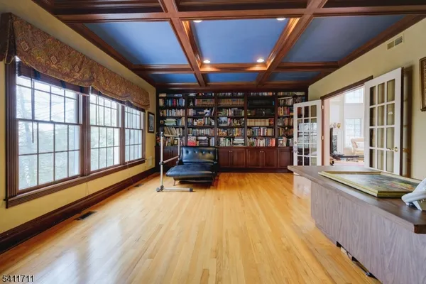 a swimming pool with wooden floor