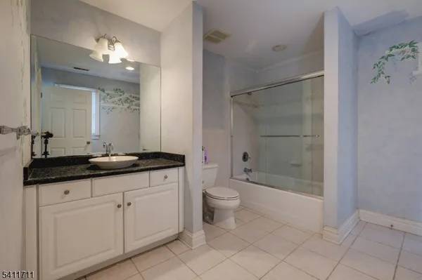 a view of a storage & utility room with a window