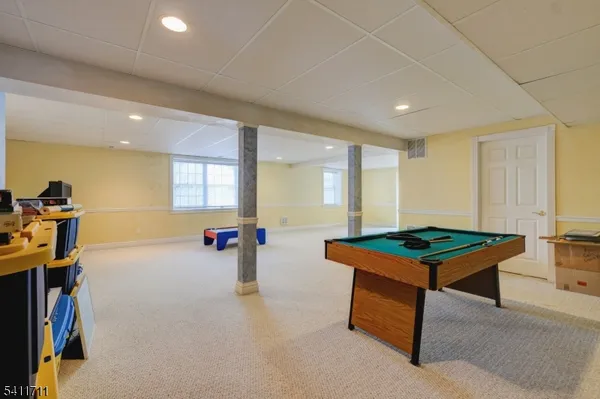 a spacious bedroom with a large bed and a large window