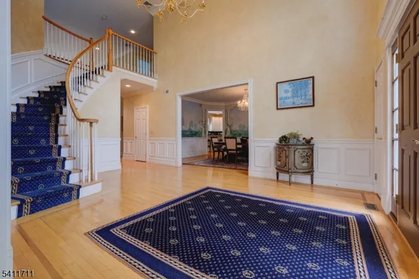 a view of lobby with lamp and wooden floor