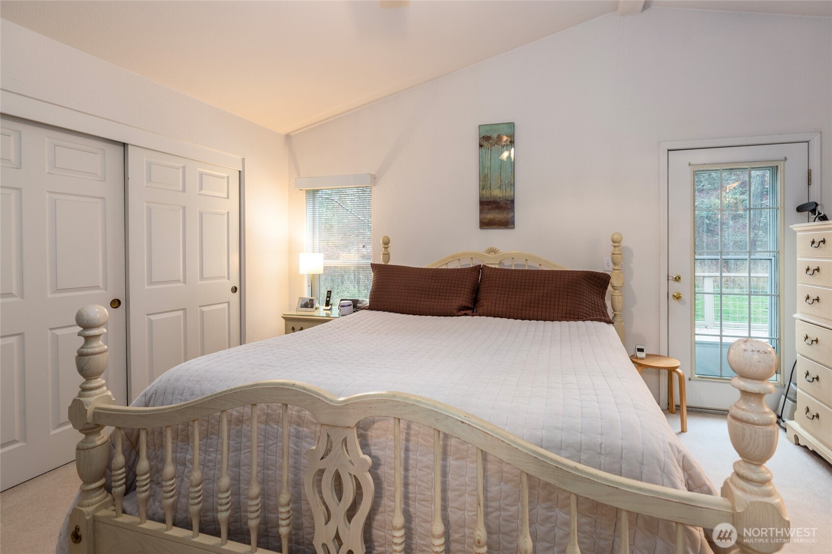 1785 Douglas Road, Unit 30 Friday Harbor, WA 98250 - Photo 13 of 32 a bedroom with a bed and wooden floor