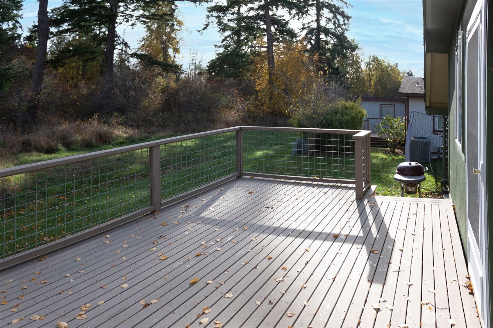 1785 Douglas Road, Unit 30 Friday Harbor, WA 98250 - Photo 4 of 32 a view of balcony with wooden floor and fence