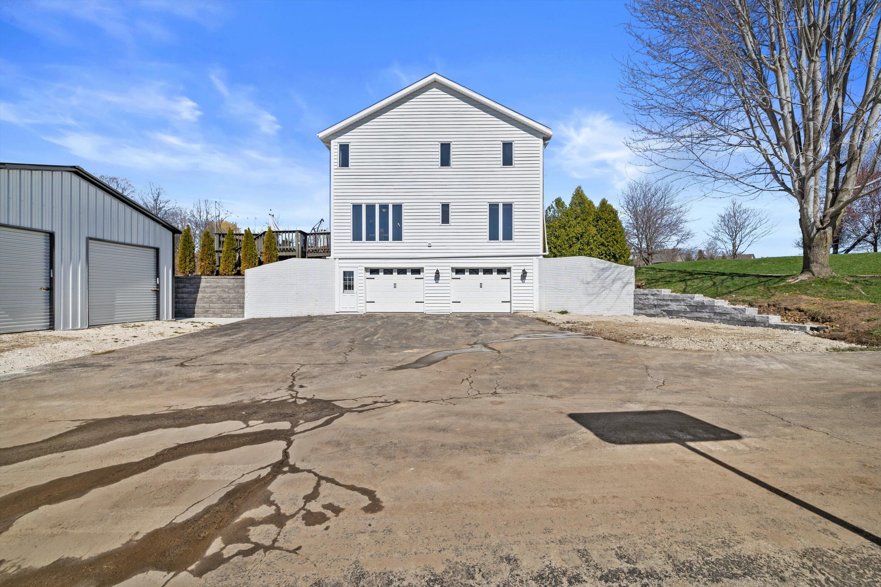 W266S8655 Rustic View Lane Vernon, WI 53149 - Photo 37 of 60 Side of home garage entrance