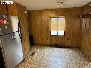 a view of entryway with wooden walls