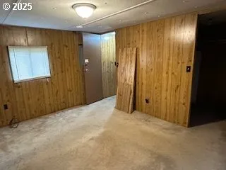 a view of a hallway with wooden shelves