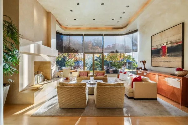 a living room with furniture and a large window