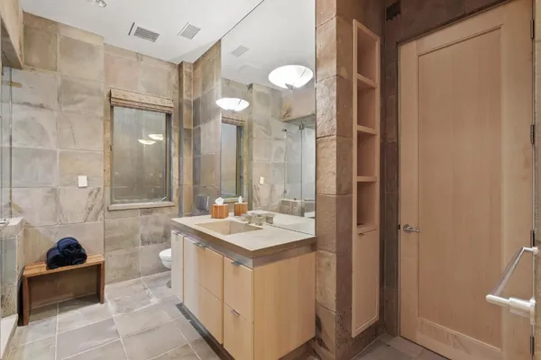 a room with a table chair and chairs