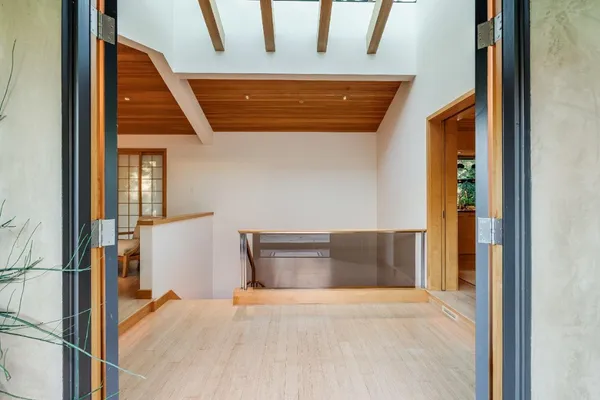 a dining room with furniture and a rug