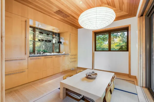 a living room with furniture a flat screen tv and a window