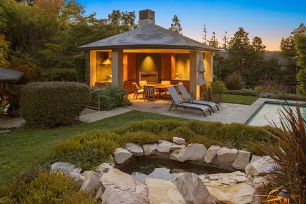 a front view of a house with garden