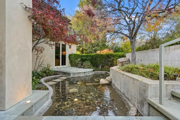 a front view of a house with garden
