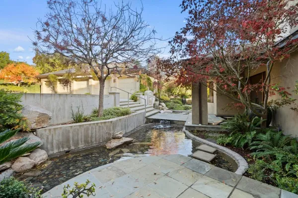a lobby with furniture and a potted plant