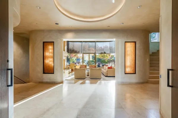 a room with table or chairs and a kitchen view