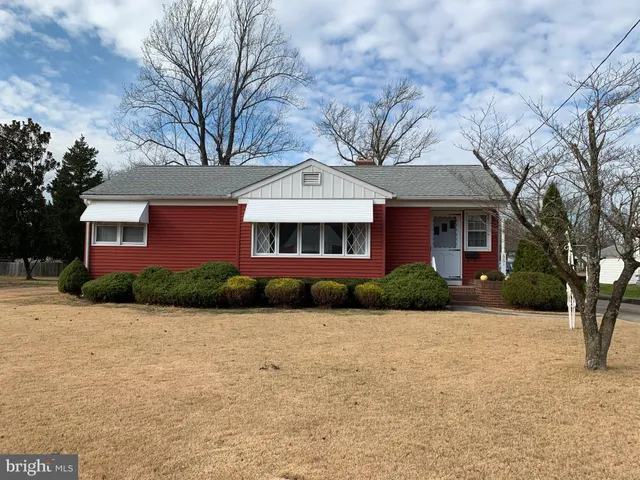 a front view of a house with yard