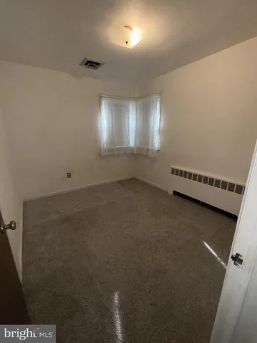 en empty room with windows