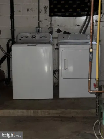 a utility room with washer and dryer