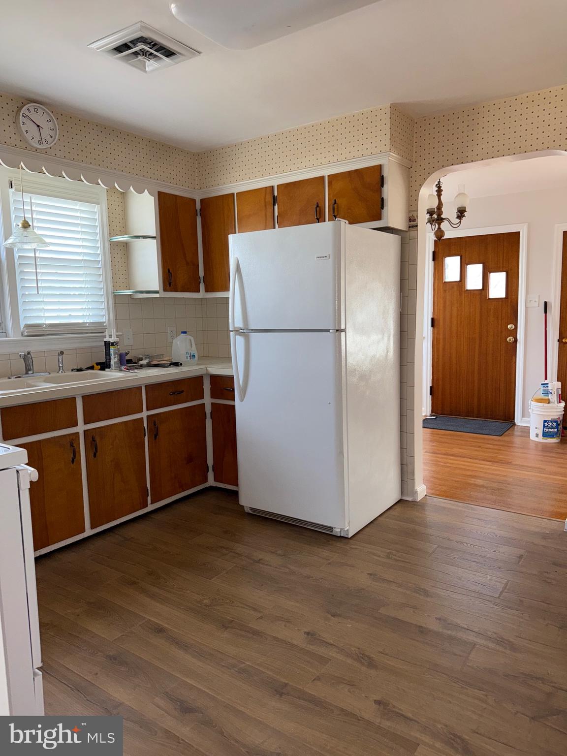 661 Grape Street Hammonton, NJ 08037 - Photo 4 of 14 a kitchen with stainless steel appliances a refrigerator and wooden floor