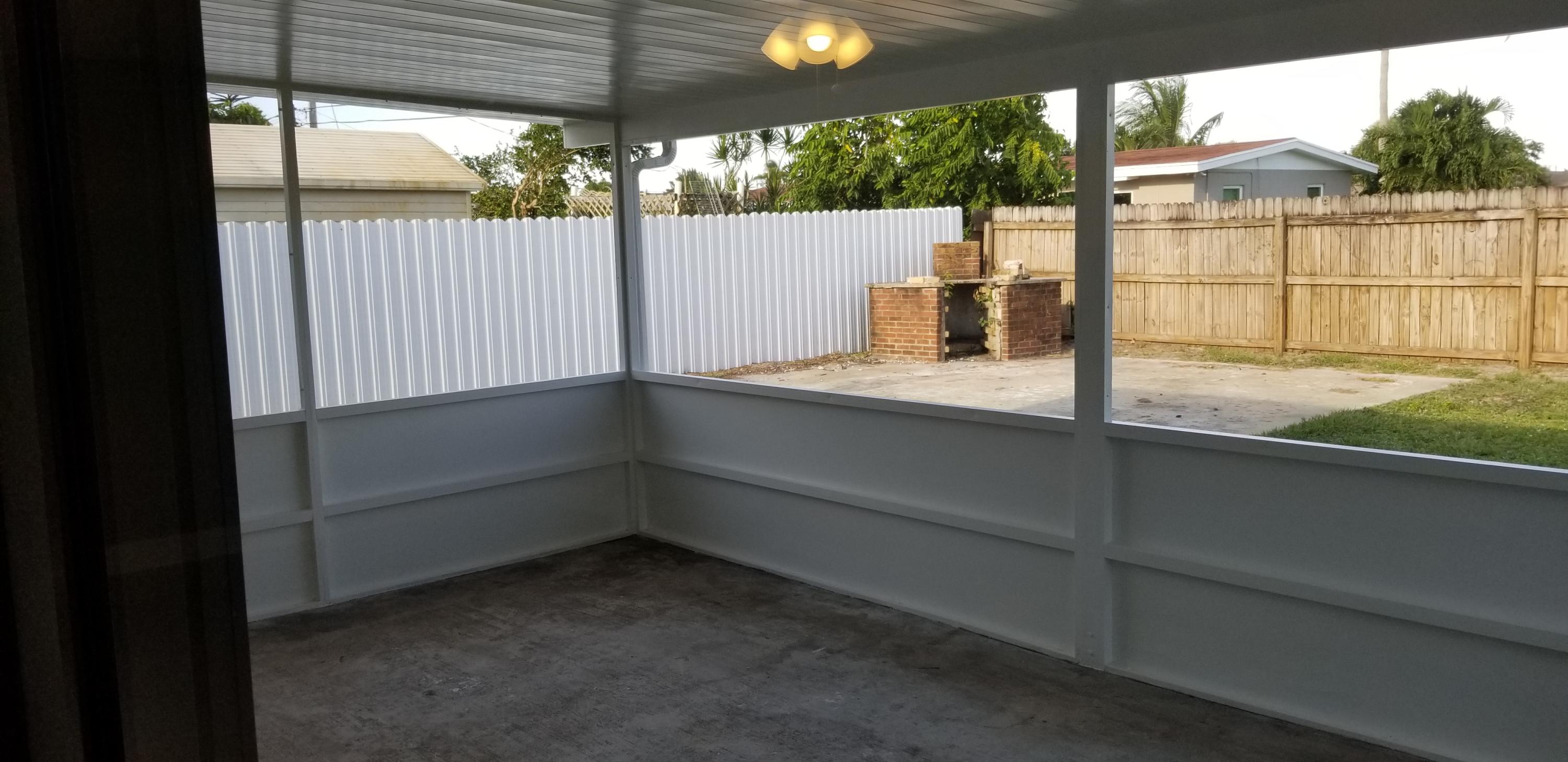 452 Los Altos Road Palm Springs, FL 33461 - Photo 6 of 9 Screened In Porch